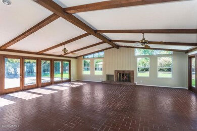 Opens to Patios + Backyard on Both Sides