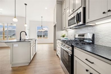 Granite counter + tile backsplash