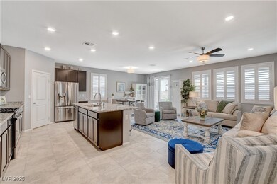 Kitchen with a ceiling fan, dark brown cabinets, a