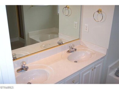 Master Bath/Spa. Double vanity, garden tub and separate shower in master bathroom.