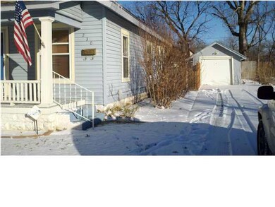 FRONT OF HOUSE WITH GARAGE