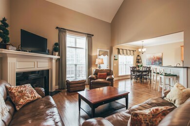 Open concept floorplan opens to the eat in kitchen where the wood floors continue!