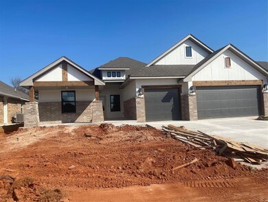 View of front of home featuring central AC and a g
