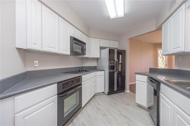 New Flooring and Cabinets in the Galley Kitchen.