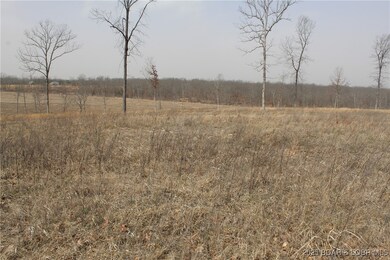 Cleared lots with gentle rolling hills.