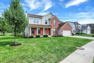 Lush lawn and covered front porch