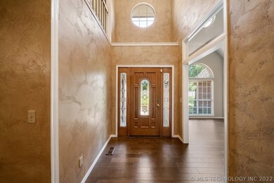Two story entry with lots of natural light. Office