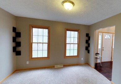 The formal living room is nice and bright, bespeak