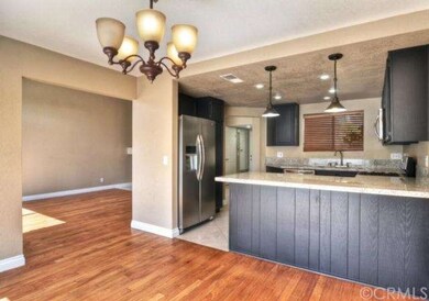 View of the kitchen with granite counters, new sta