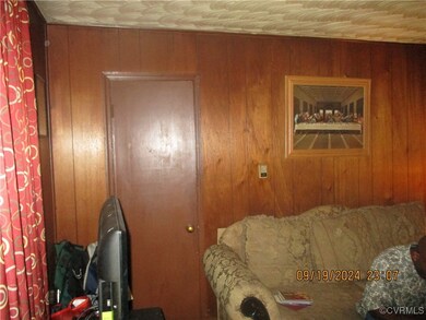 Living room with wood walls
