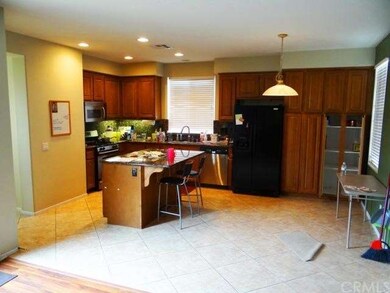 Plenty of cabinets, breakfast bar at island, open 