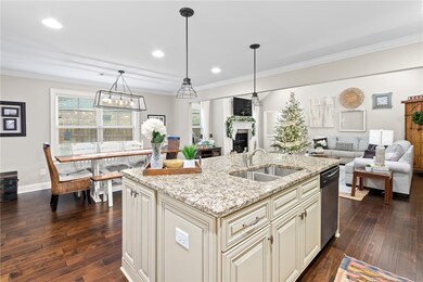 The living room, kitchen, and dining space have an