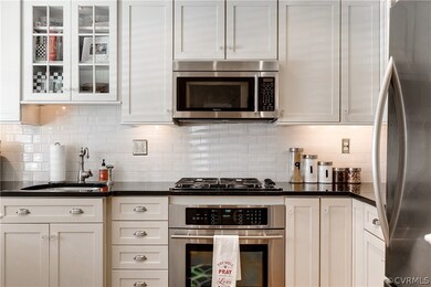 Absolute black granite counters and subway tile ba