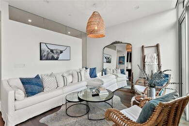 Living room with recessed lighting, arched walkwa
