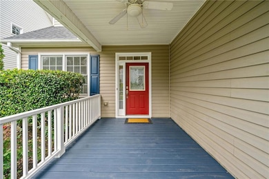 Entrance to property with ceiling fan