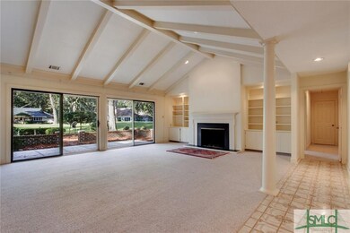 LIVING ROOM. Vaulted ceilings give this room an op