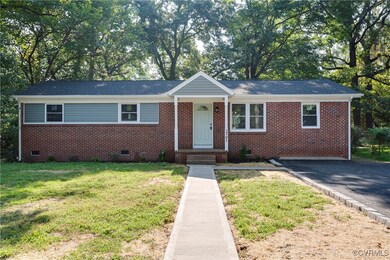 Ranch-style house with a front lawn