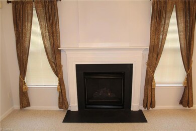 Gas log fireplace with blower