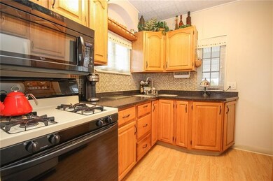 Lovely, updated and functional, this galley-type k