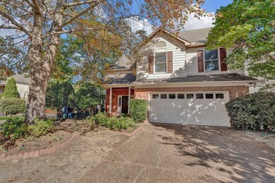 View of front facade featuring a garage