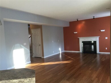 Family room with gas fireplace and bamboo floors.