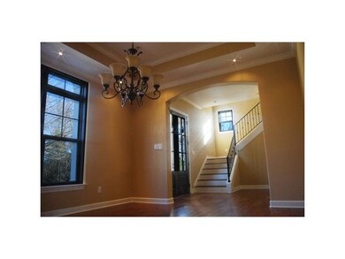 Double entry doors, hardwood staircase with wrough