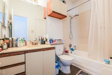 Full bathroom with shower / bath combination with