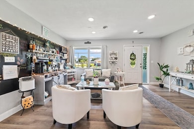 entryway w/ sitting area & coffee bar