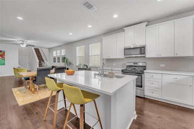 Kitchen featuring appliances with stainless steel