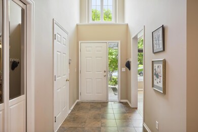Extra tall ceiling in the foyer offer a spacious feel upon entry.
