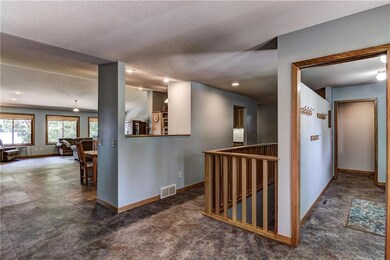 The roomy foyer offers a glimpse of the lake. On t