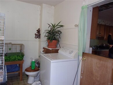 Laundry area with first floor toilet