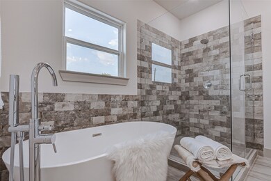 Stand alone tub and pristine walk-in shower in the