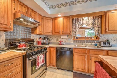 Beautiful kitchen with newer appliances and oak ca
