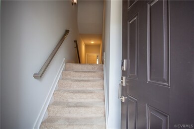 Stairway featuring carpet