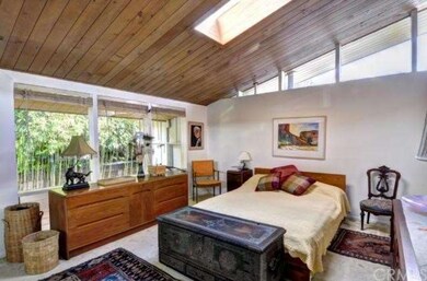 Master bedroom suite faces private side yard. Tria