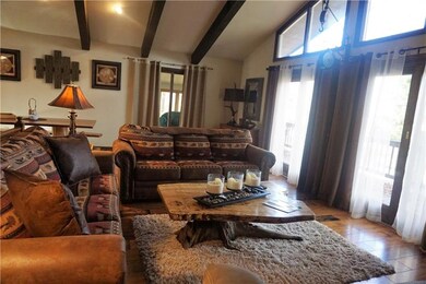 Upper floor main living room with doors overlookin