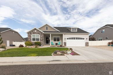 Craftsman-style home with concrete driveway, a porch, and a garage