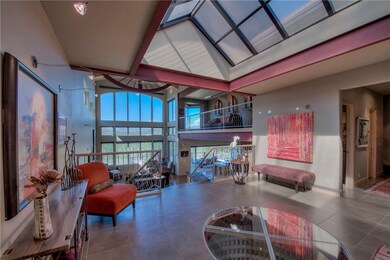 Interior Entry with glass floor look into Wine Roo