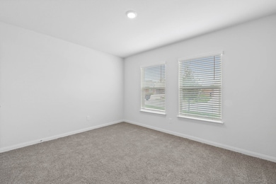 Unfurnished room with light carpet and baseboards