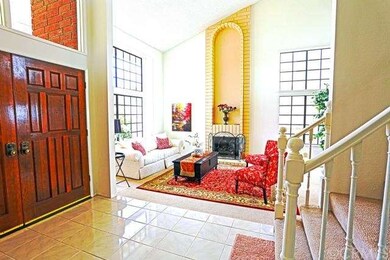 Inviting entry looking into formal dining room. Ca