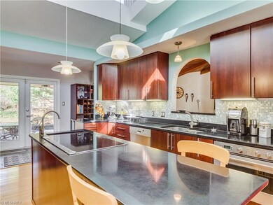 Kitchen with a pass through to the family room and
