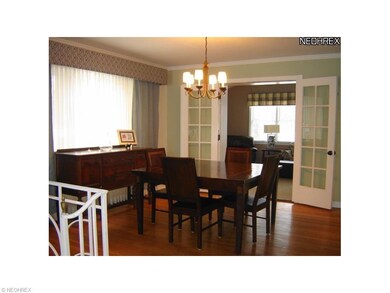 Step up to the freshly painted dining room which b