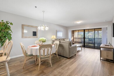 Dining area featuring a notable chandelier and har