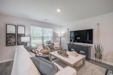 Living room featuring wood finished floors and baseboards