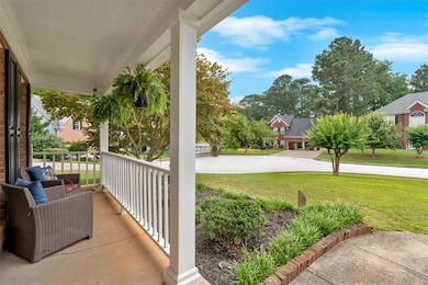 Covered porch with a yard