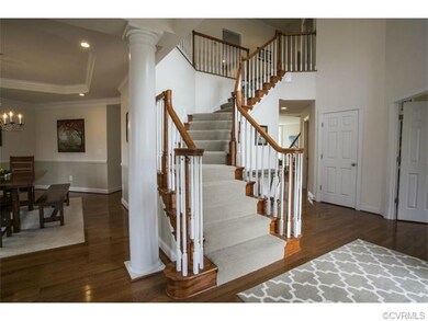 Front staircase is turned oak.