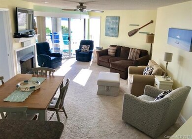 View from kitchen looking into dining area and gre