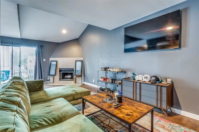 Living room featuring a fireplace, hardwood / wood