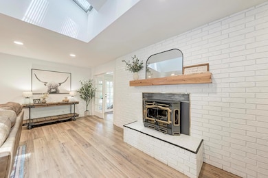 Living room featuring light wood-type flooring, a